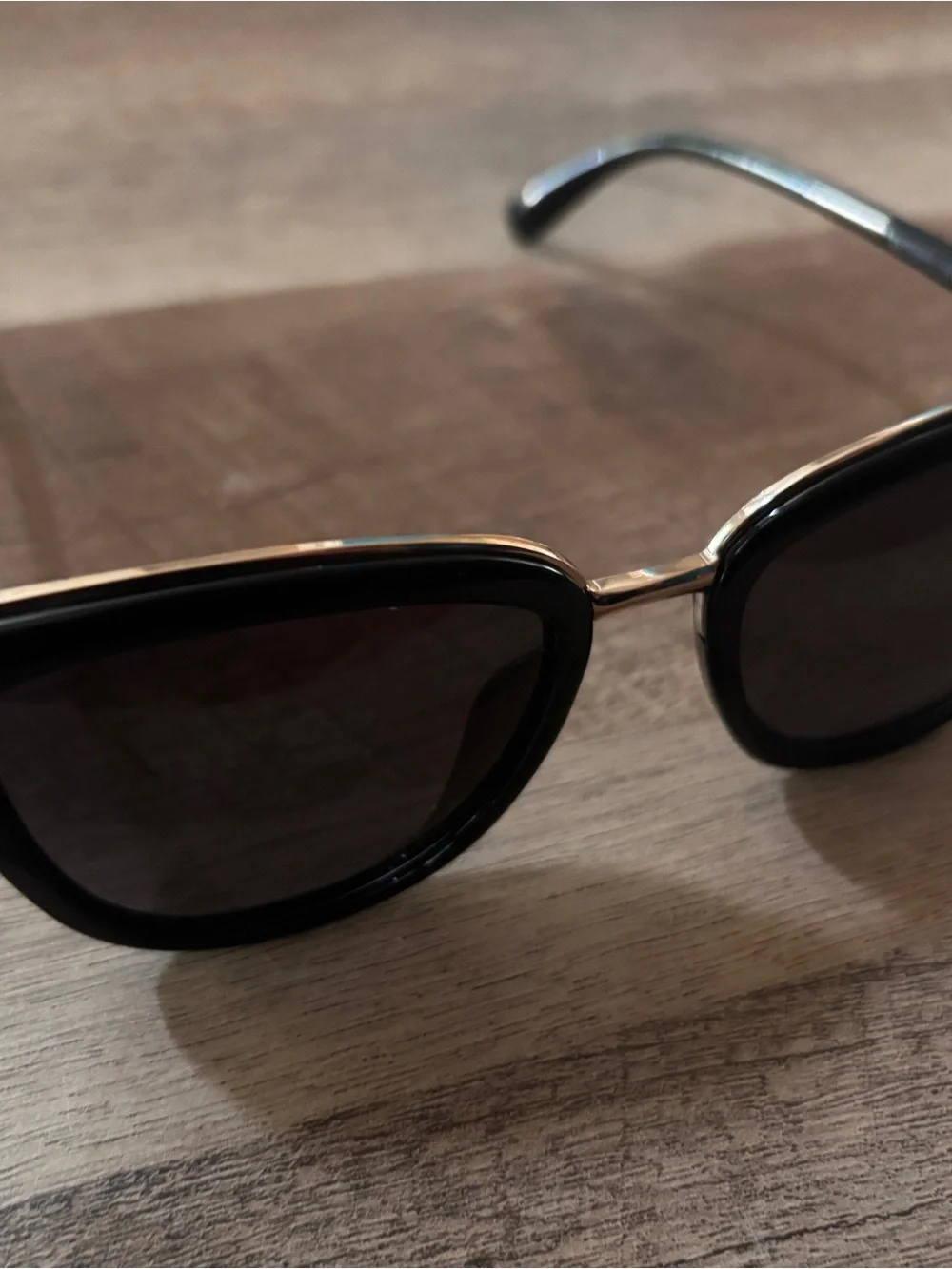 Black Oval Sunglasses with Gold Bridge